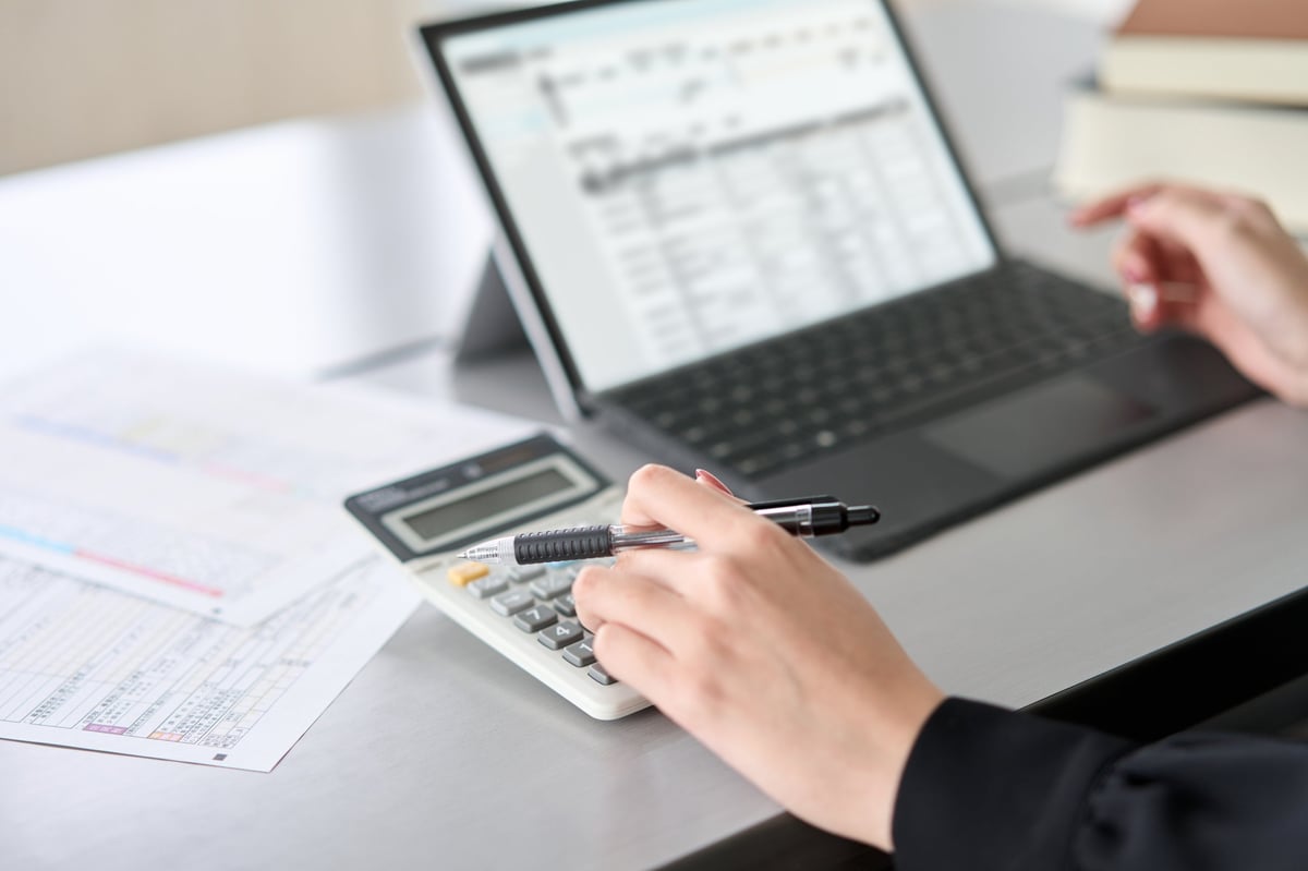 Bookkeeper entering client records into accounting software